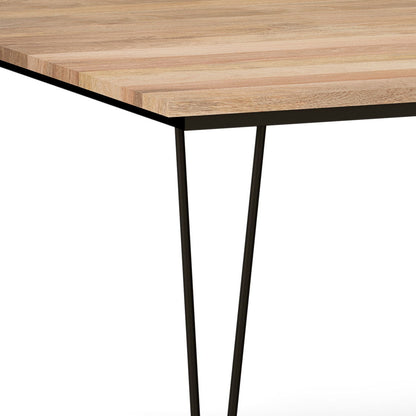 A close-up of the Hunter - Square Tabletop Dining Table's corner, featuring a light natural wood finish and thin black metal legs, set against a white background.