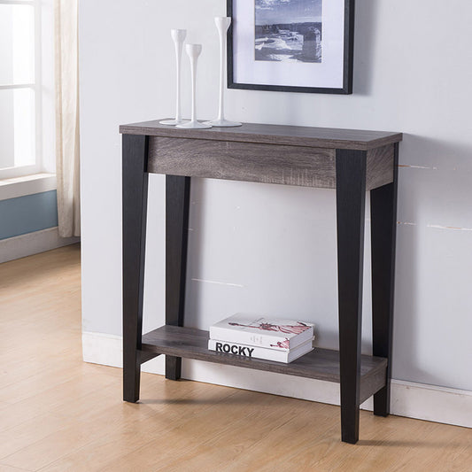 The Modern Two Toned Console With Two Shelves, featuring black legs and a lower shelf with books, is topped with three white vases and placed against a wall beneath a framed picture in a bright room.