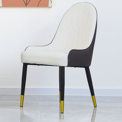 The Modern PU Sponge-Filled Dining Chair (Set of 2) features a white cushioned seat and back, black outer shell and legs with gold tips, perfect for restaurants, living rooms, or rooms. Shown on a light gray floor against a white wall.