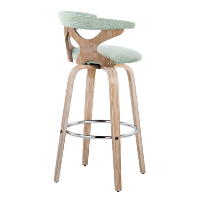 The Gardenia - Contemporary Fixed Height Barstool With Swivel (Set of 2) features light wood legs, a circular metal footrest, green upholstered seat and backrest, and a curved open-back design with smooth modern lines.