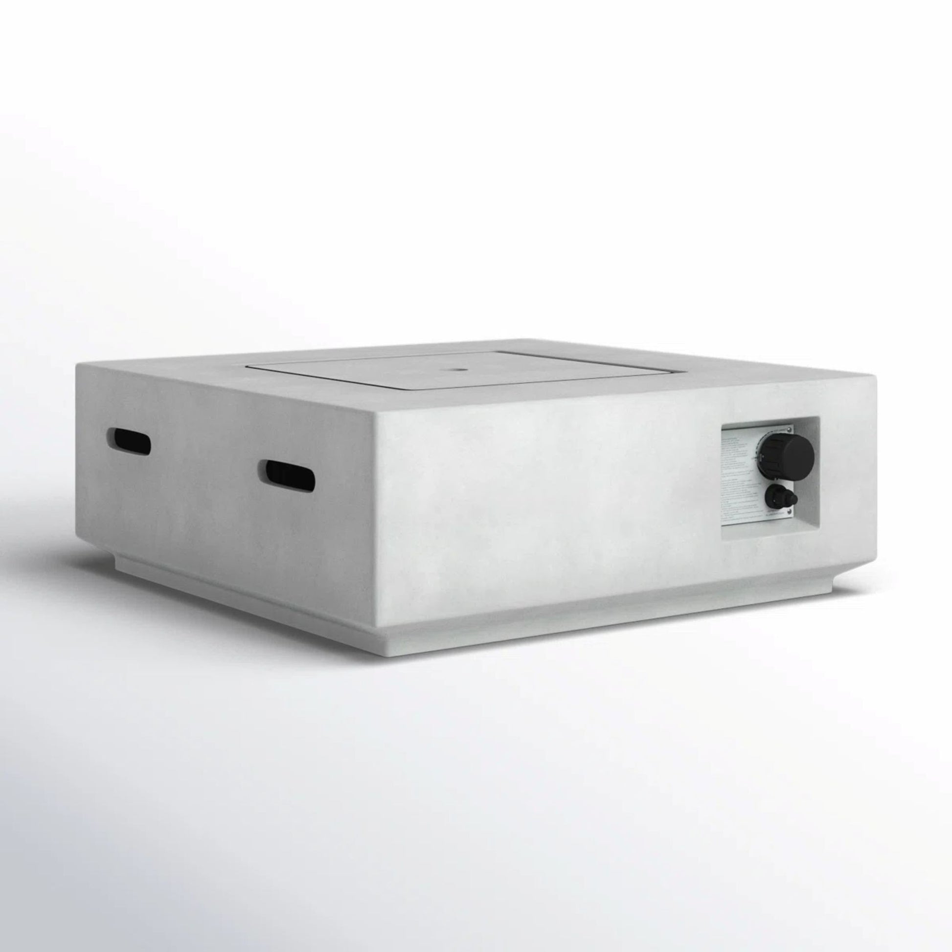 The Reinforced - Propane / Gas Fire Pit Table is a minimalist rectangular concrete tabletop fire pit with smooth edges, side vent slots, and a metallic control knob on the front right corner, shown against a plain white background.