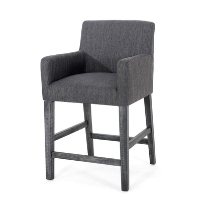 The Serenitia - Upholstered Counter Chair With Straight Arm features a modern dark gray upholstered seat, back, and arms, complemented by wooden legs and footrests in a matching dark finish for a simple, contemporary look.