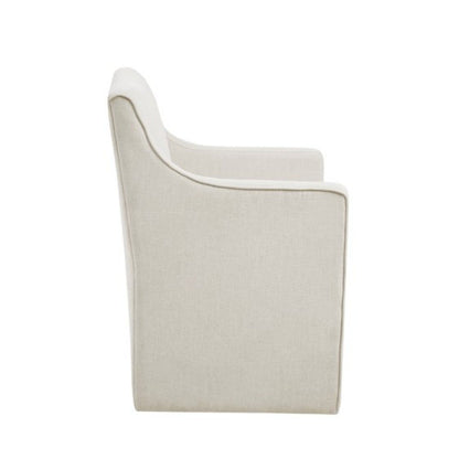 Side view of the Traditional Skirted Dining Arm Chair, upholstered in light beige fabric with clean lines, a straight back, subtly curved armrests, and a tailored skirt. The chair is set against a plain white background.