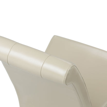 A close-up of the top and backrest of the Cosmopolitan - Deluxe Tufted Parson Upholstered Chair (Set of 2), featuring cream-colored leather, smooth lines, and subtle stitching, shown against a white background.