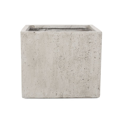 The Modern Outdoor Planter is a rectangular, light gray concrete planter with a rough, textured surface. It is shown empty and viewed from the front against a white background.