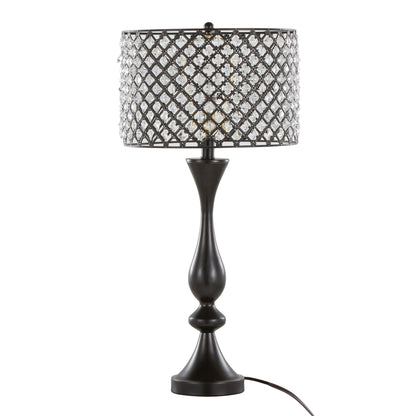 The Topaz - Contemporary Table Lamp features a black sculpted base and a drum lampshade with a lattice pattern and crystal-like accents, plus a visible cord for plugging in.