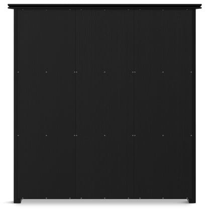 The Artisan - Cube Storage is a large, black, four-door unit with a smooth modern design, featuring small metallic handles and visible screws for a minimalist, contemporary appearance.