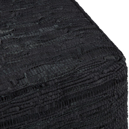 Close-up of the corner of the Fredrik - Handcrafted Square Pouf, highlighting its textured black fabric and woven, ridged pattern.