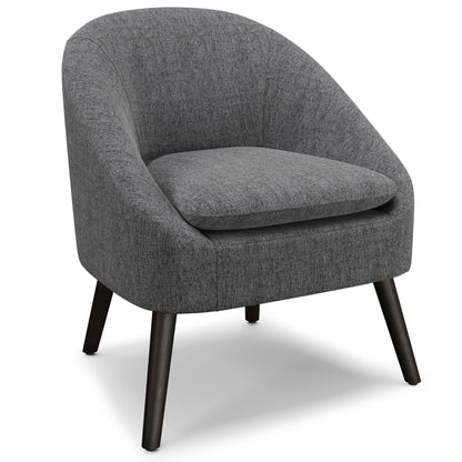The Redding Upholstered Accent Chair features a modern rounded back, dark wooden legs, and grey upholstery. Its thick, plush seat cushion is designed for comfort.