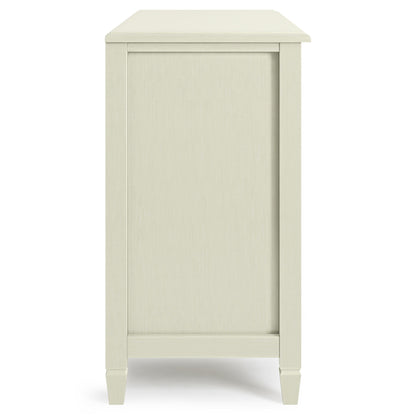 Side view of the Connaught - Handcrafted Low Storage Cabinet in light wood, featuring minimalist design, simple clean lines, four tapered legs, flat panel front, and subtle wood grain texture.