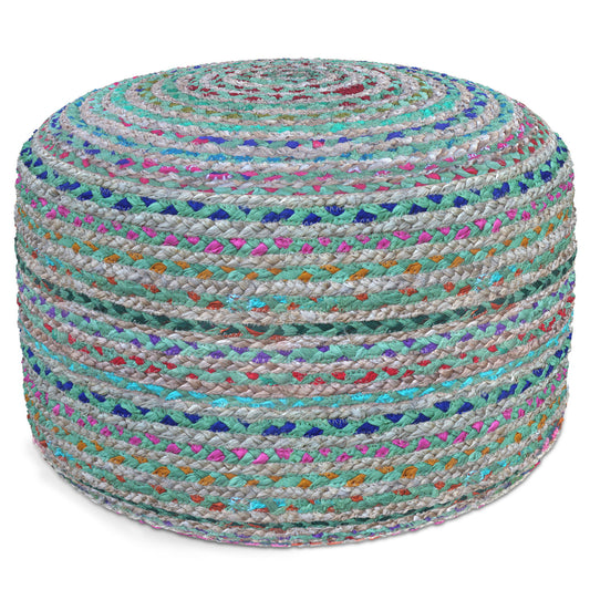 The Margo - Handcrafted Round Pouf features a round, multicolored design with blue, green, pink, and purple fabric strips woven into a tightly coiled, textured braided pattern.