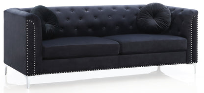 The Elegant Contemporary Sofa features black velvet upholstery, silver studded trim, two round black pillows, and sleek metal legs, displayed against a white background.