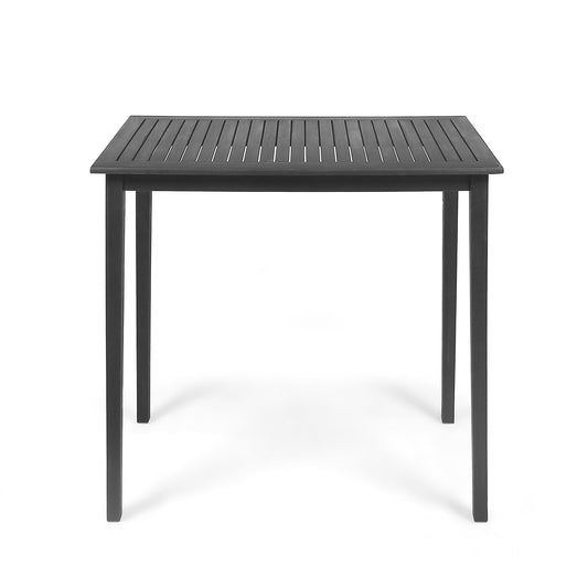 The Outdoor Minimalist Acacia Wood Rectangle Bar Table features a black, slatted tabletop and four straight legs, shown against a plain white background.