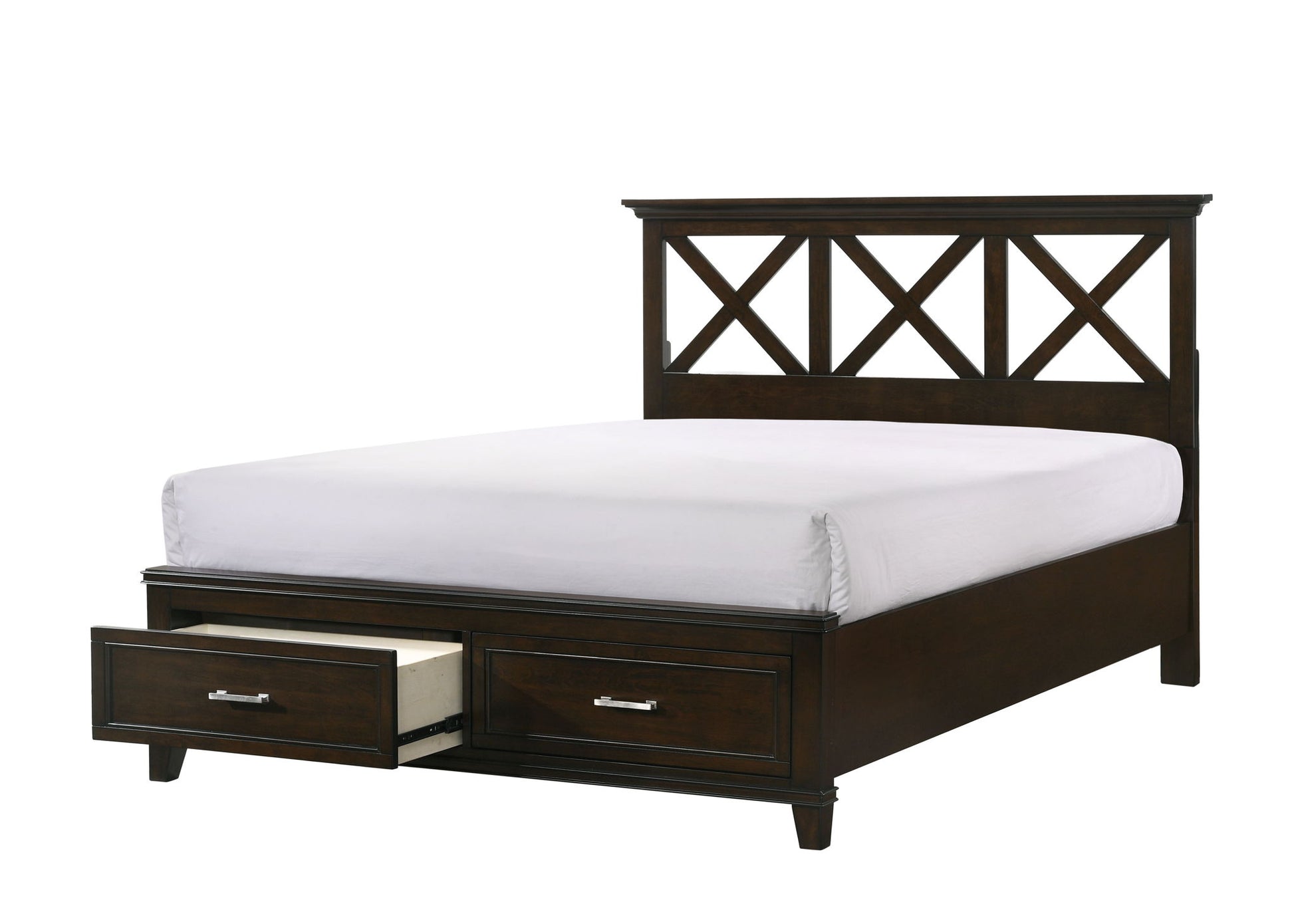 The X Ample Storage Bed features a dark wood frame, geometric headboard, and two front storage drawers—one open to reveal a pillow inside. It’s shown made up with a white fitted sheet.