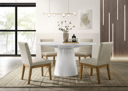 A modern dining room featuring the Jasper - Wide Contemporary Round Dining Table Set with four beige upholstered chairs, a central vase with greenery, abstract wall art, a linear pendant light, and sunlit large windows.