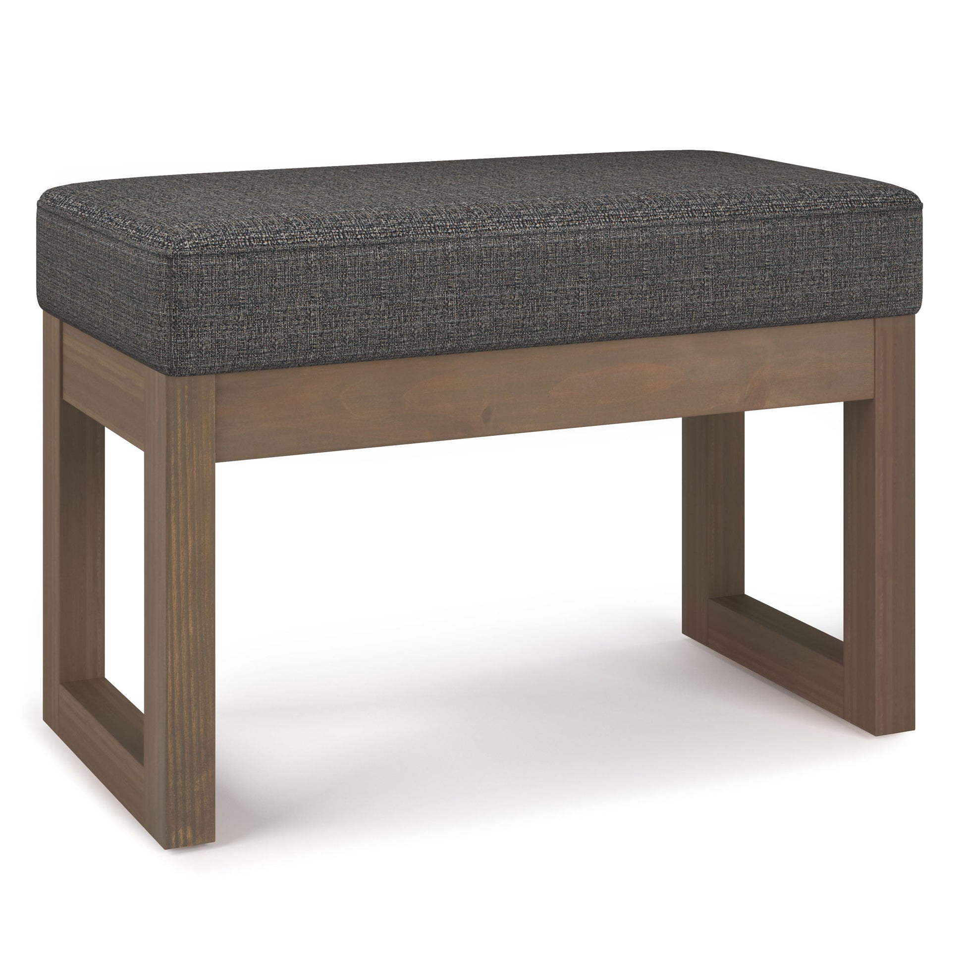 The Milltown Upholstered Ottoman Bench features a rectangular, dark gray cushion and a wooden base with clean, open rectangular legs on each side for a modern look.