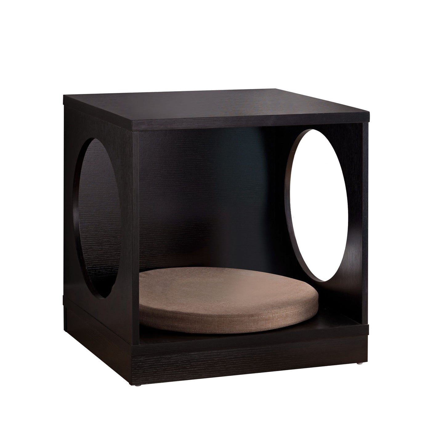 The Circle Design Comfortable Pet End Table With Removable Mat - Red Cocoa is a modern black wooden cube with large circular side openings and a round tan cushion inside.