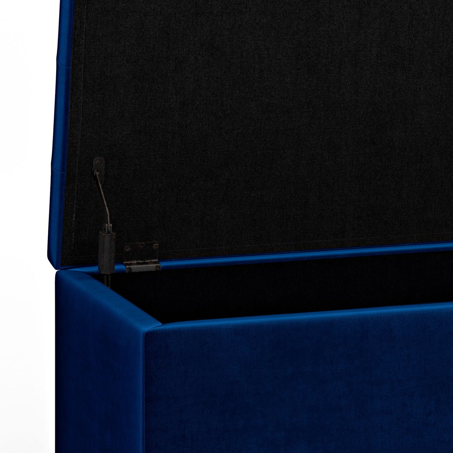 A close-up of the Cosmopolitan - Upholstered Storage Ottoman in blue, open to reveal a black fabric-lined interior and a hinge mechanism on the left side.