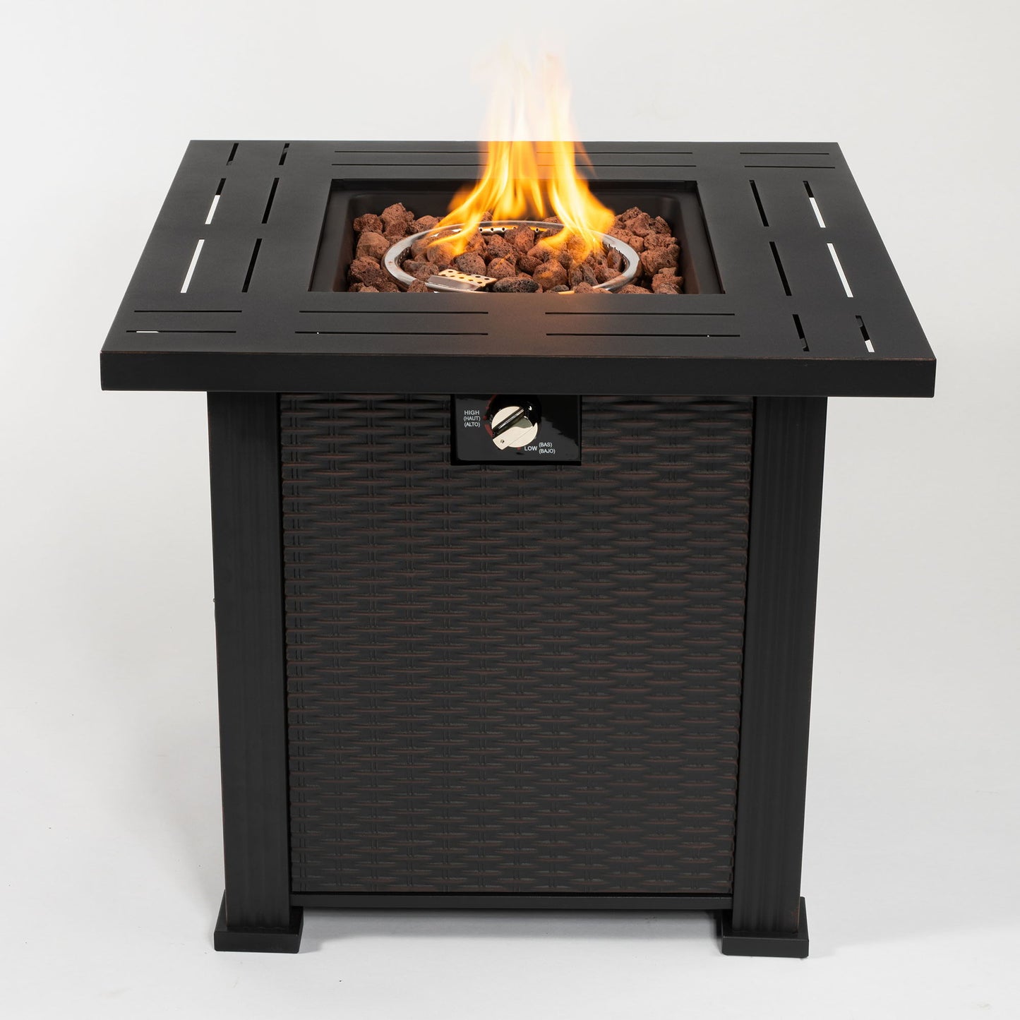 The 28" Square Fire Pit Table - Brown features a black metal frame with wicker-style sides, a visible flame over lava rocks at the center, and a front control knob.