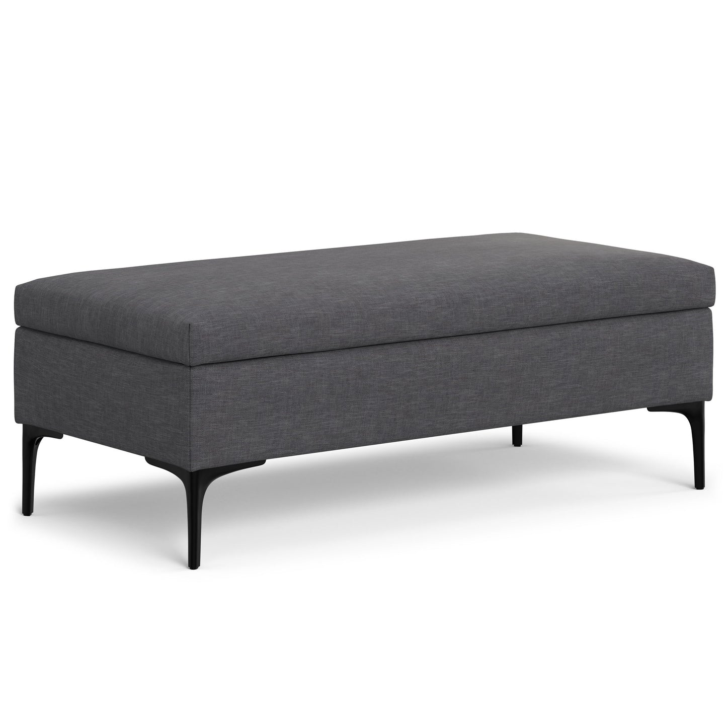 The Rebecca is a rectangular, dark gray upholstered storage ottoman with a cushioned top, slim black metal legs, and a lift-up lid for multifunctional use as a coffee table.