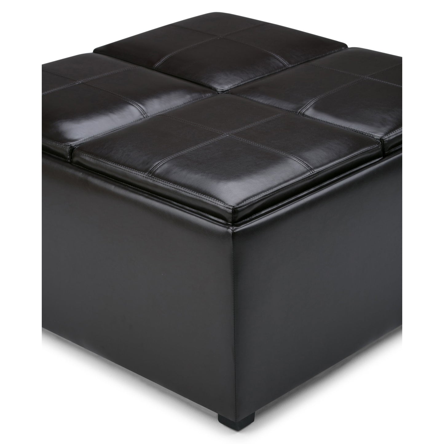 A close-up of the Avalon Square Coffee Table Storage Ottoman in Tanners Brown, featuring black leather, visible stitching, and four cushioned sections. Its simple, modern design makes it a stylish storage solution.