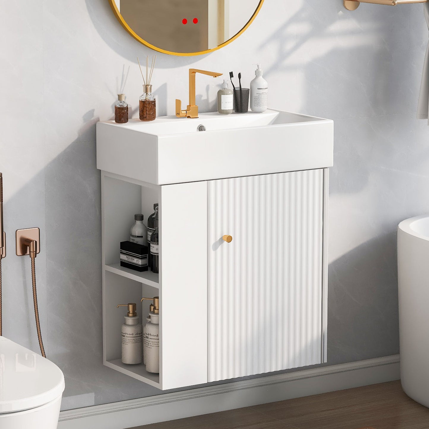 The Modern Floating Bathroom Vanity With Ceramic Basin is perfect for small bathrooms, featuring a rectangular sink, gold faucet and knobs, open shelves for storage on the left, and a circular mirror above against a light gray wall.
