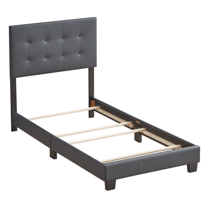 The Caldwell - Bed is a modern single bed frame featuring a dark tufted upholstered headboard, sturdy wooden slats, and dark legs, shown without a mattress against a white background.