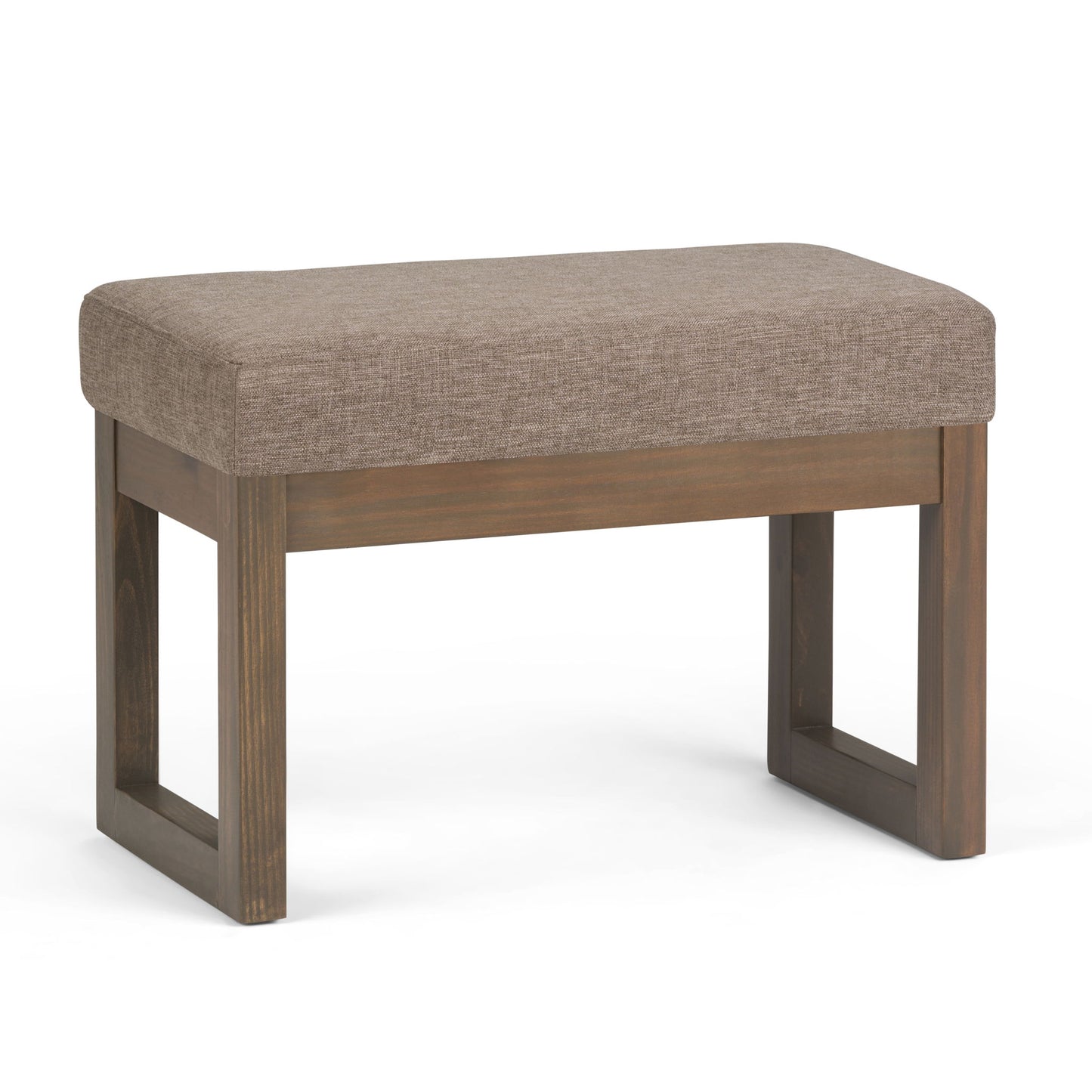 The Milltown Upholstered Ottoman Bench features a rectangular cushioned seat in light brown fabric and a wooden base with open rectangular legs.
