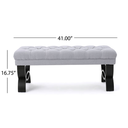 The Hilton Ottoman Bench features a classic style, gray upholstery with a tufted top, black curved legs, and measures 41"W x 16.75"H.