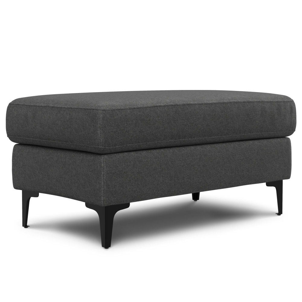The Ava - Mid Century Sofa With Ottoman Set features a modern, rectangular dark gray ottoman with black metal legs, a thick cushioned top, and a clean, minimalist design.