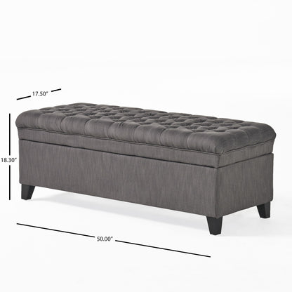 The Juliana Storage Ottoman features a rectangular, dark gray tufted design with black birch legs. It measures 50"L x 17.5"D x 18.3"H and is shown on a white background with dimension lines.