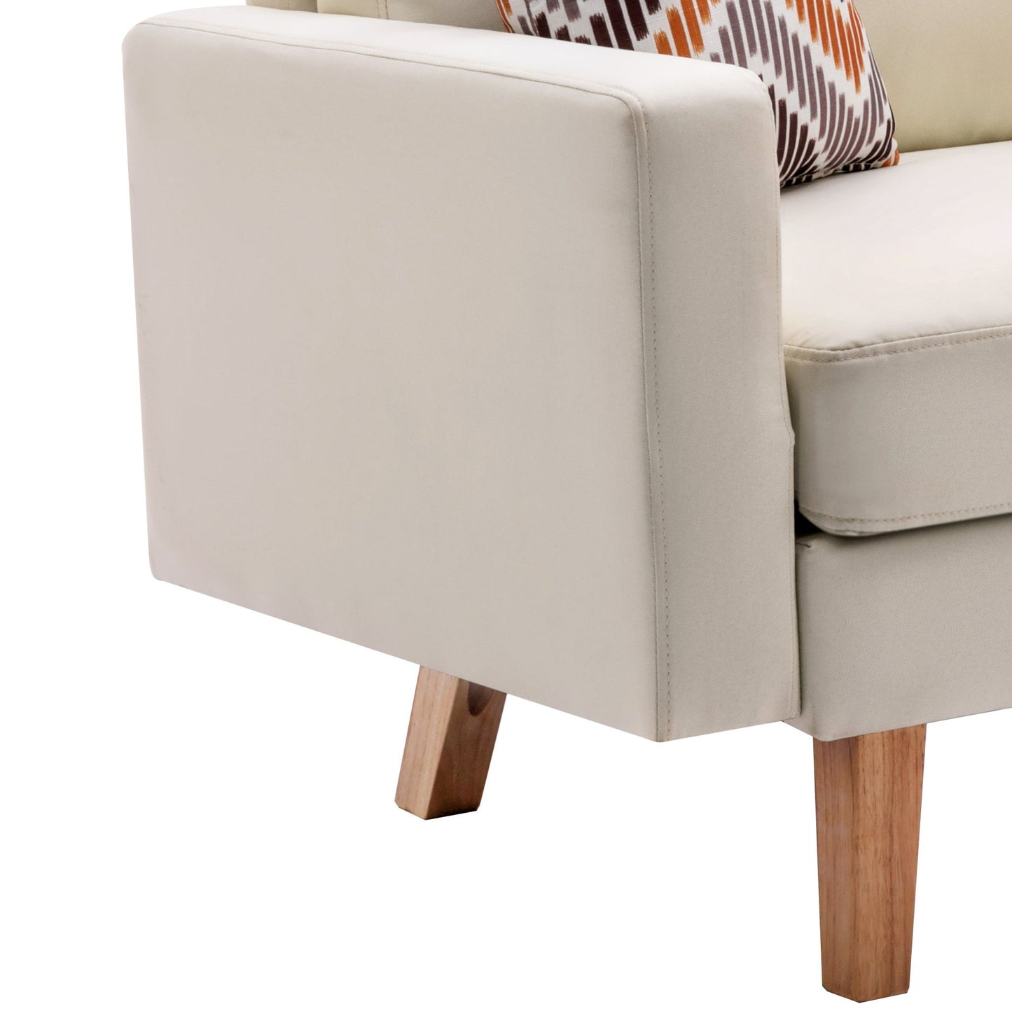 A close-up of the Bahamas Minimalistic Sofa in beige upholstery with wooden legs, styled with two throw pillows featuring a geometric brown, orange, and white pattern.