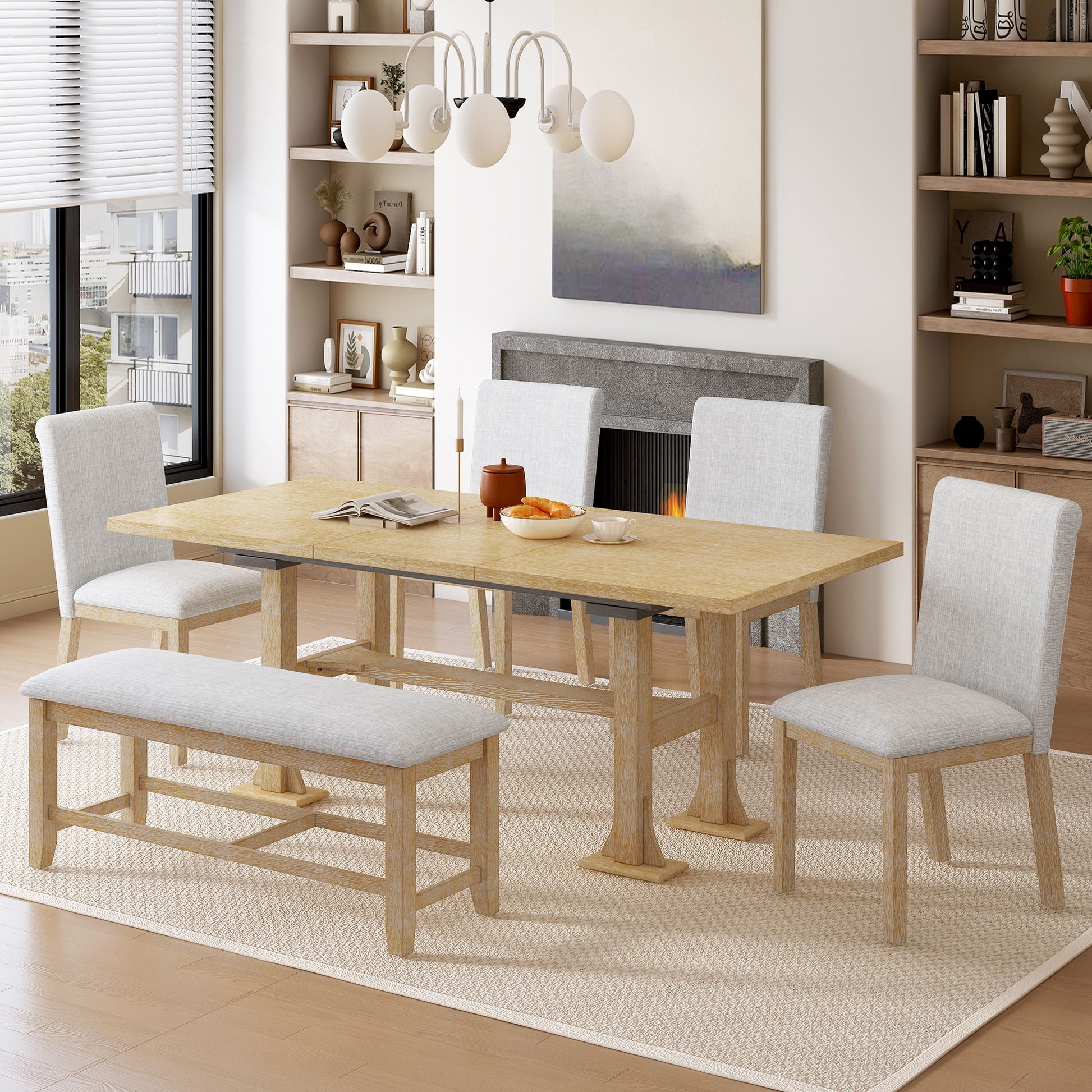 A modern dining room features the Topmax 6 Piece Farmhouse Extendable Dining Table Set with a removable leaf, four upholstered chairs, and a matching bench on a beige rug. Shelves, fireplace, window, and pendant light complete the scene.