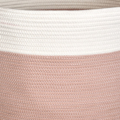 Close-up of the Francis - Cotton Round Laundry and Storage Basket, featuring a textured zigzag pattern. The upper part is white, while the lower section is muted pink, crafted from tightly stitched cotton for durability and style.