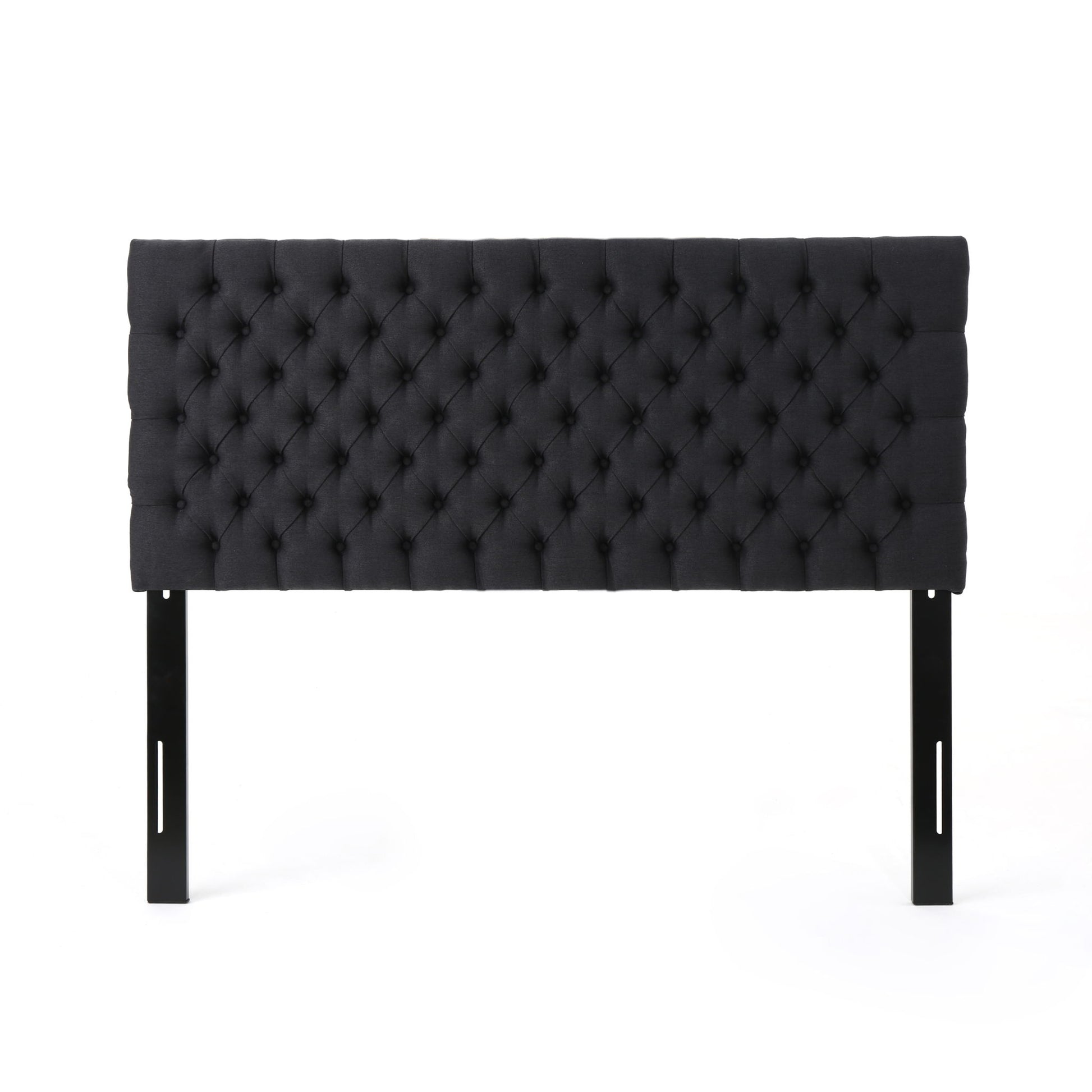The Annecy - Contemporary Upholstered Headboard is black, rectangular, features tufted upholstery with button detailing, and includes two black legs. Shown against a white background.