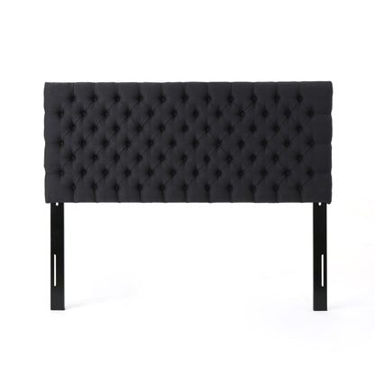 The Annecy - Contemporary Upholstered Headboard is black, rectangular, features tufted upholstery with button detailing, and includes two black legs. Shown against a white background.