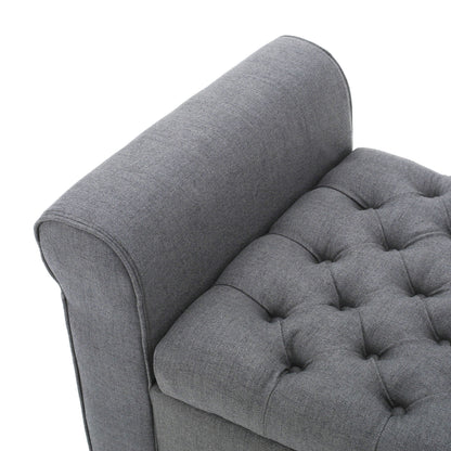 Close-up view of the Hayes Contemporary Armed Storage Bench featuring gray upholstery, rolled arms, and button tufting—highlighting the fabric texture and stitching details.