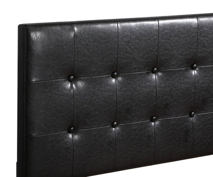 A close-up of the Caldwell Bed's black faux leather tufted headboard, featuring button accents and a smooth, cushioned surface.