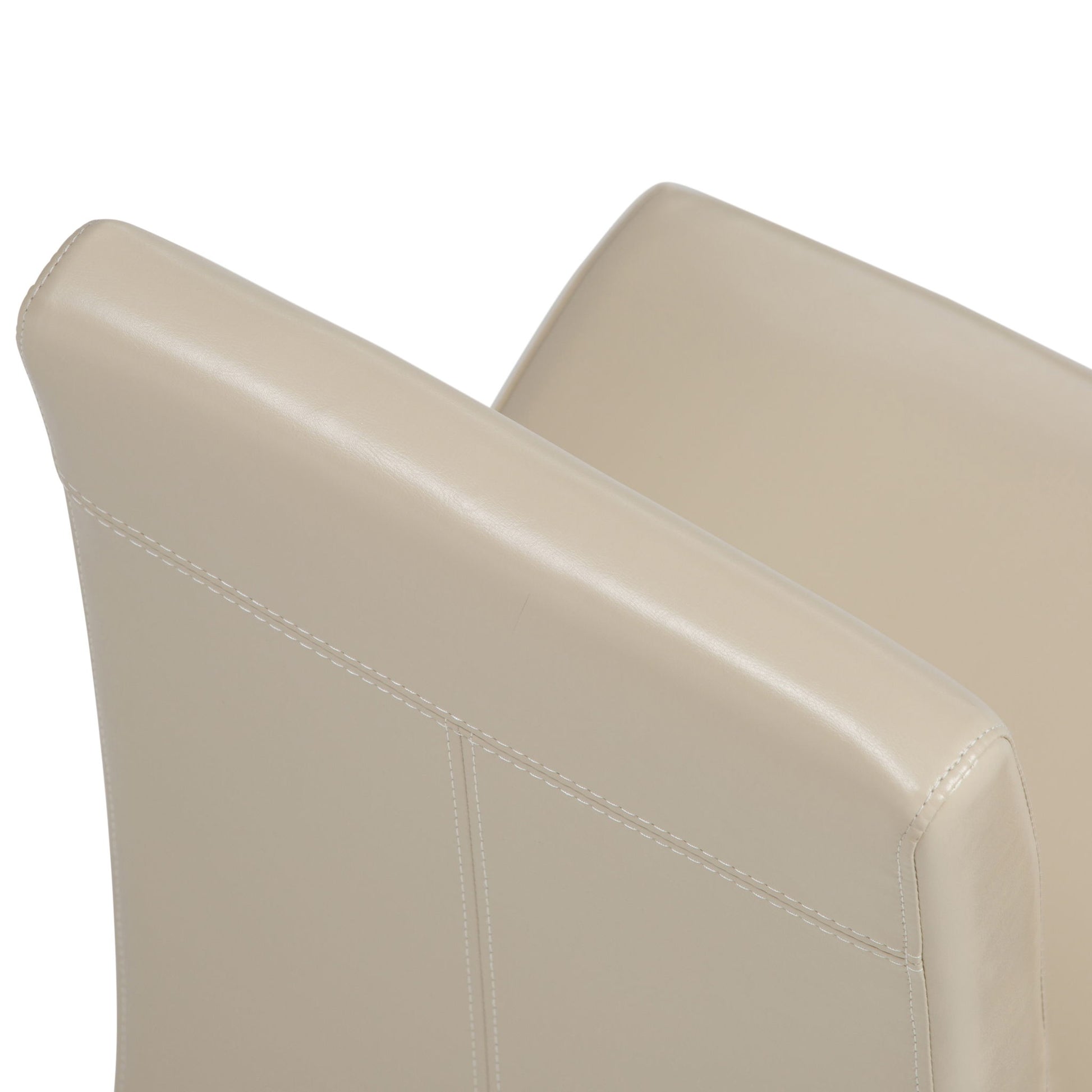 Close-up view of two Acadian Upholstered Parson Dining Chairs (Set of 2) in beige leather with visible stitching detail, shown positioned side by side against a white background.
