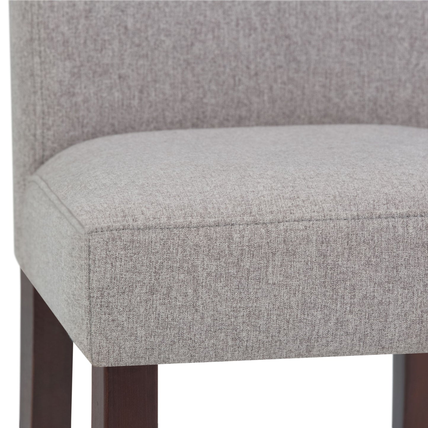 Close-up of the Acadian - Upholstered Parson Dining Chair seat, featuring light gray fabric, dark wooden legs, and a straight, partially visible back. Set of 2.