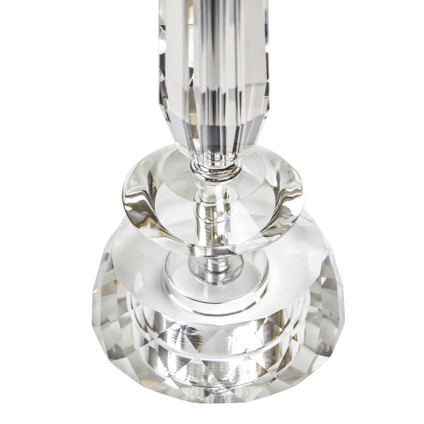 Close-up of the Karat Contemporary Crystal Table Lamp. The clear prismatic design captures and reflects light for a shimmering effect, featuring a tapered, vertically-cut column on a round base. Comes in a set of two with chrome details and white softback shades.