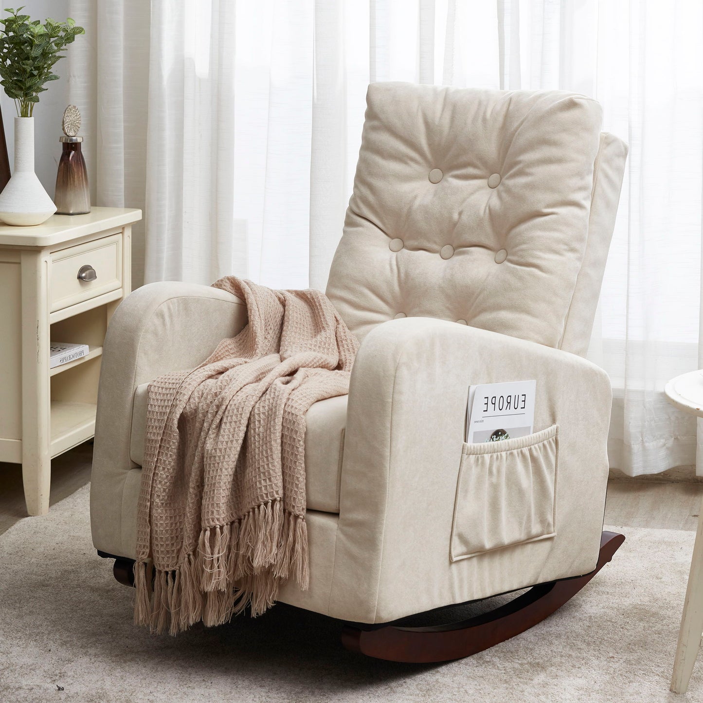 A cozy sunlit living room features the Single Sofa Reclining Japanese Chair Lazy Sofa Tatami Balcony Adjustable Chair in beige, cushioned with a pink knitted throw on the armrest, a book in the side pocket, and set on a soft rug.