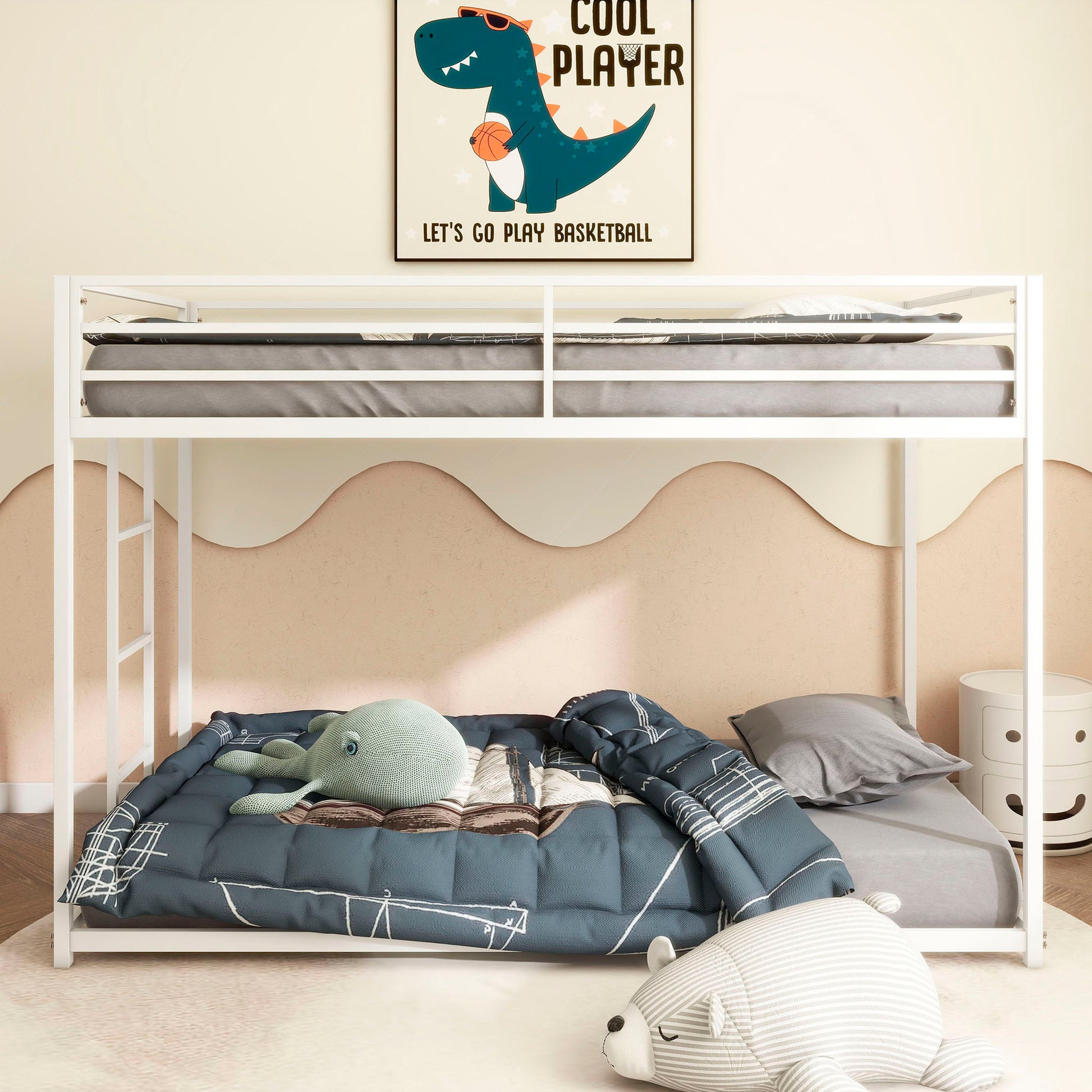 A children's bedroom with the white Adam - Metal Bunk Bed, blue bedding, a stuffed octopus toy, gray pillow, and a white bear plush on the floor. A dinosaur basketball poster above reads: "Cool Player. Let's Go Play Basketball.