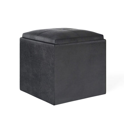 The Rockwood Upholstered Cube Storage Ottoman with Tray features a black, square design with a cushioned top and smooth sides, shown on a plain white background.