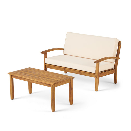 The Outdoor Chat Set With Coffee Table And Loveseat includes a beige cushioned wooden loveseat and matching rectangular coffee table, both with a natural wood finish and slatted design—perfect for outdoor lounging.