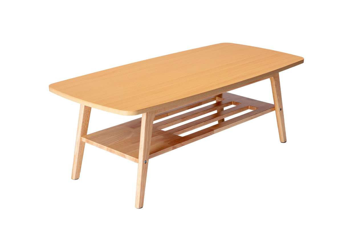 The Bahamas - Living Room Set features a rectangular wooden coffee table with rounded edges, angled legs, and a lower slatted storage shelf, all in a modern design with a light wood finish.