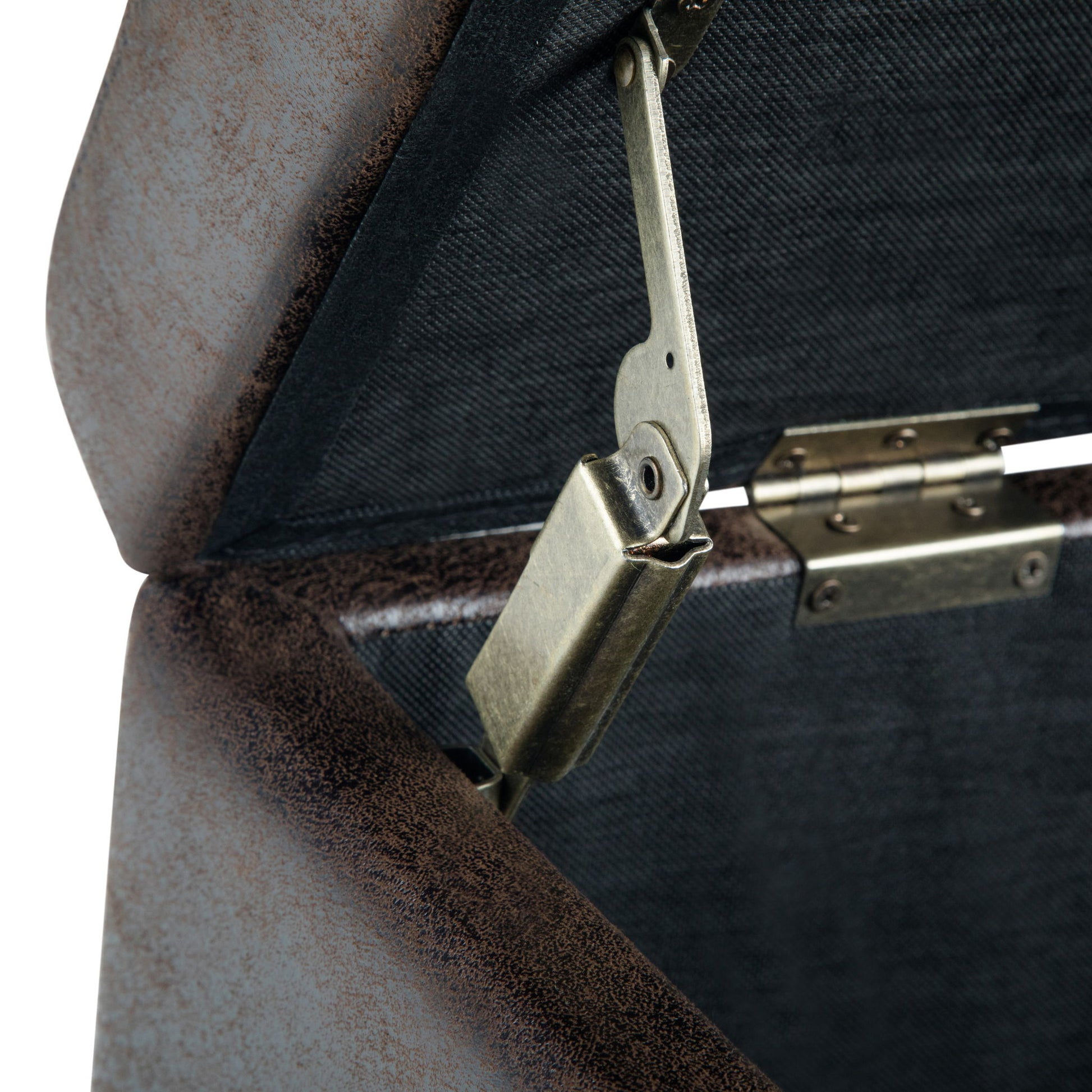 Close-up view of the hinge and support hardware inside the Avalon Storage Ottoman Bench in Distressed Brown, highlighting its metallic mechanism and fabric-lined interior.