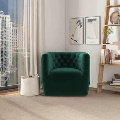 The Delaney Ergonomic Design Swivel Chair in green velvet sits by a large window with city and mountain views, next to a woven basket. Two abstract prints hang on the white wall, with shelves holding décor and books on the right.