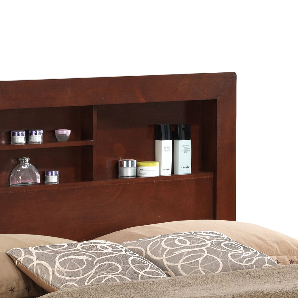 The Stylish Storage Bed For Modern Spaces features a wooden headboard with shelves for skincare products and jars, complemented by two patterned pillows and beige bedding.