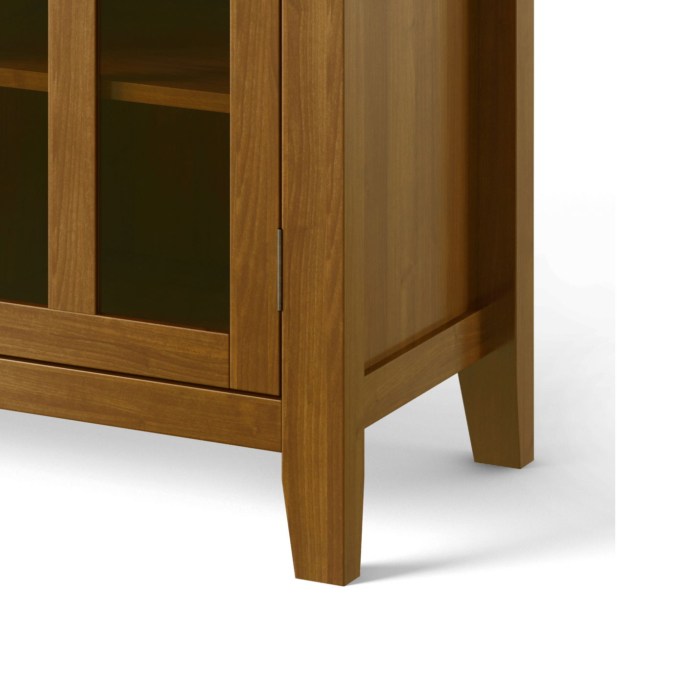 A close-up of the lower corner of the Artisan Handcrafted Tall TV Media Stand with glass doors, highlighting its smooth finish, straight legs, and simple, modern design.